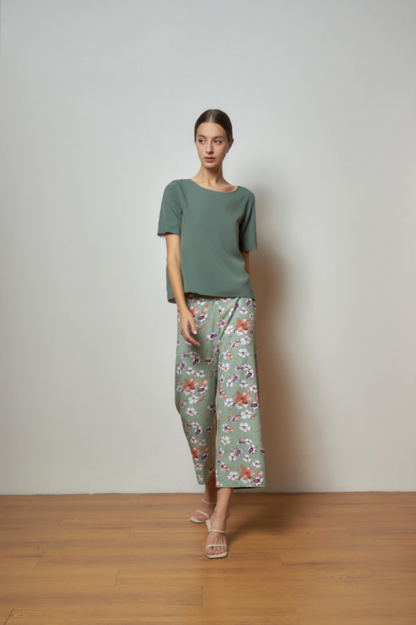 Reversible Signature Pants with green floral prints and light green