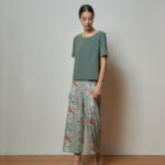 Reversible Signature Pants with green floral prints and light green