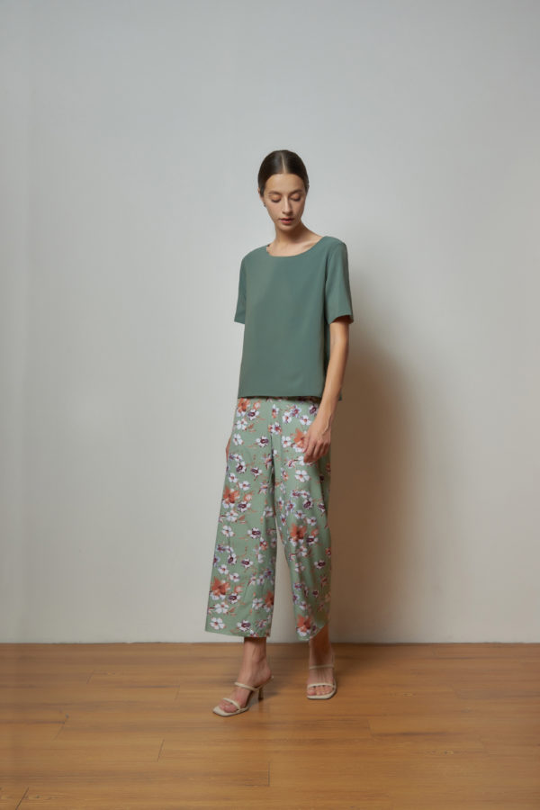 Reversible Signature Pants with green floral prints and light green